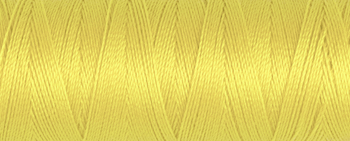 Spool of yellow Gutermann Maraflex elastic sewing thread