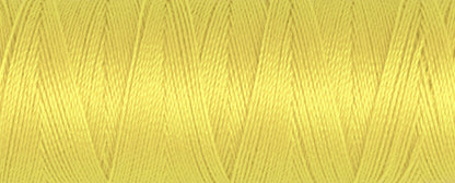 Spool of yellow Gutermann Maraflex elastic sewing thread