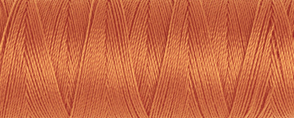 Spool of Gutermann Maraflex elastic thread in coral