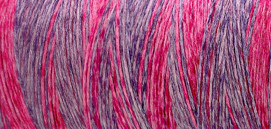 Madeira Aeroflock textured overlock thread on a mini king spool in petunia