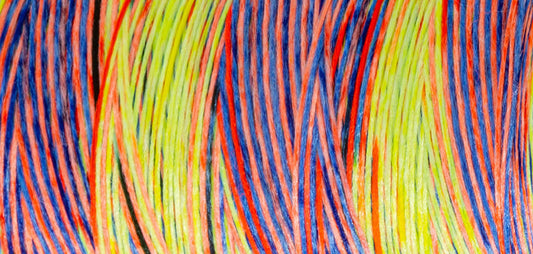 Madeira Aeroflock textured overlock thread on a mini king spool in chameleon