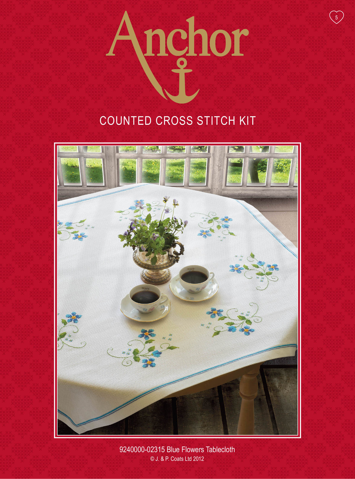 Anchor cross stitch tablecloth with blue flower design
