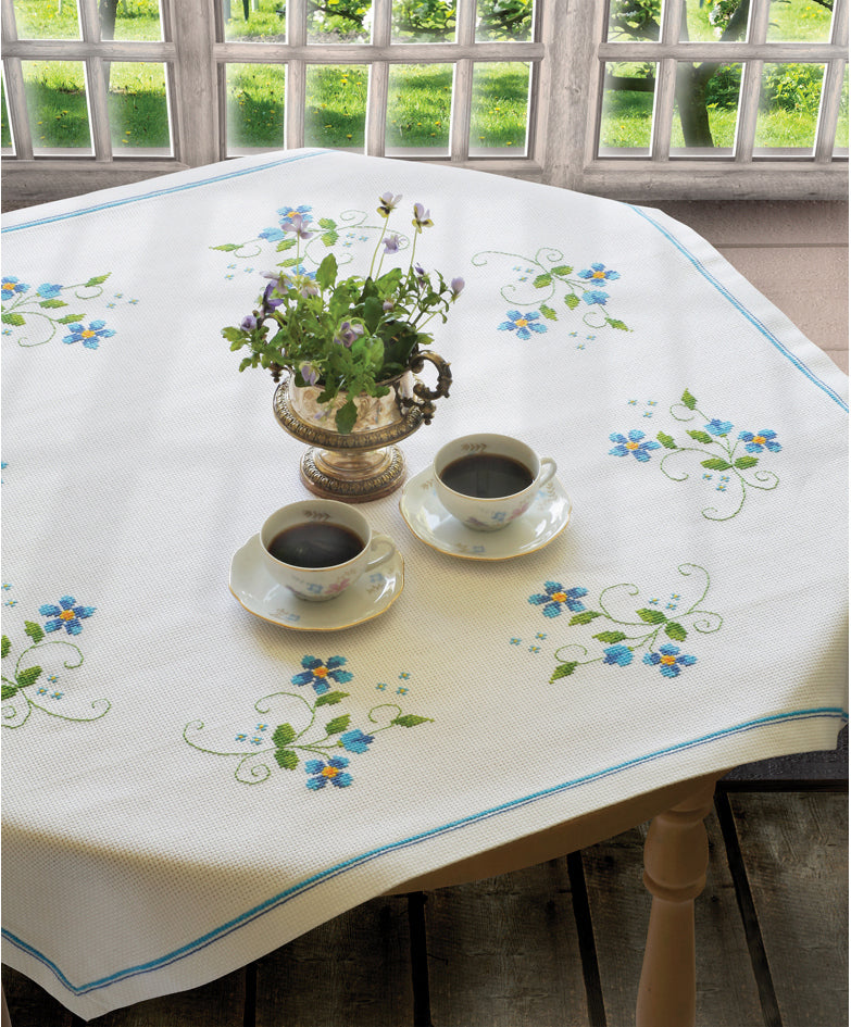 Anchor cross stitch tablecloth with blue flower design