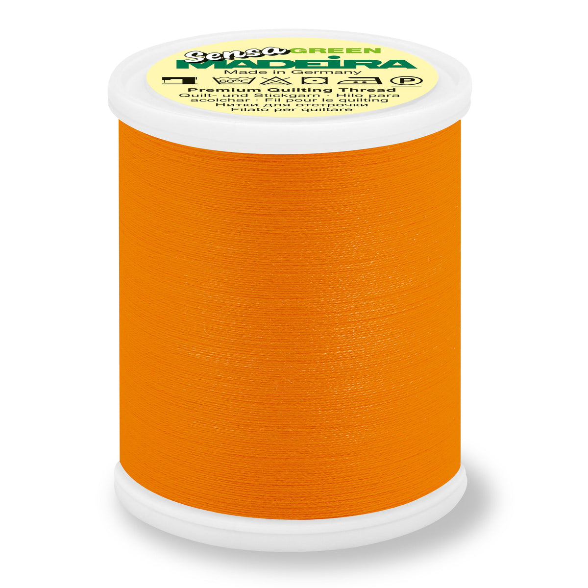 Spool of Madeira Sensa Green embroidery thread in sunset