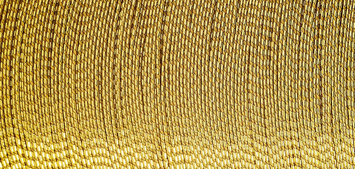 Spool of Madeira Glamour metallic thread in antique gold