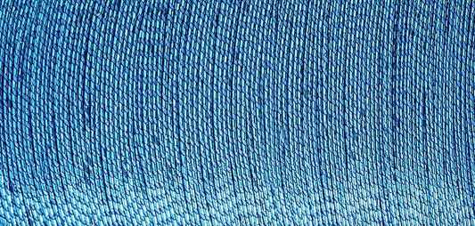 Spool of Madeira Glamour metallic thread in turquoise