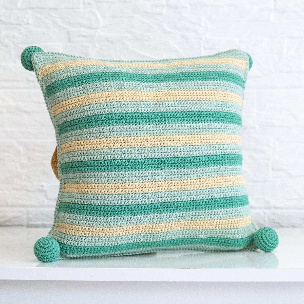 Crocheted puppy cushion cover made from the Anchor kit