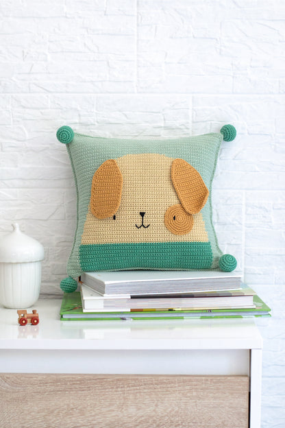Crocheted puppy cushion cover made from the Anchor kit