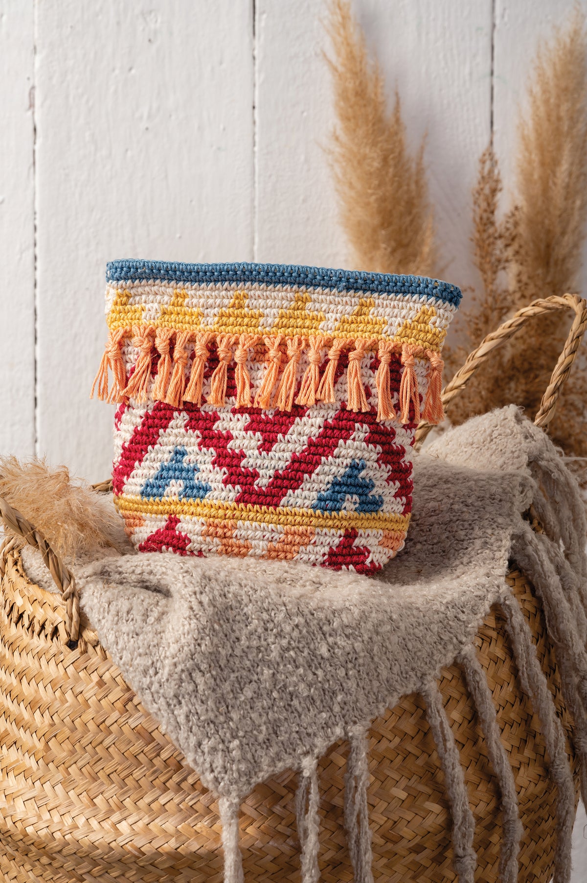 Crocheted boho zip pouch in brights colours from the Anchor kit