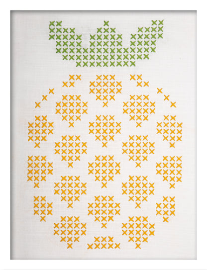 Embroidered pineapple design on white fabric