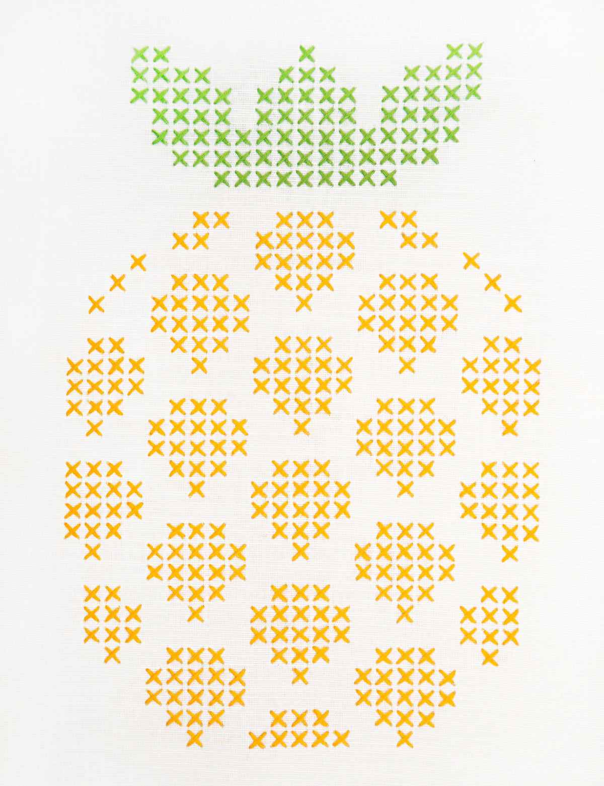 Embroidered pineapple design on white fabric