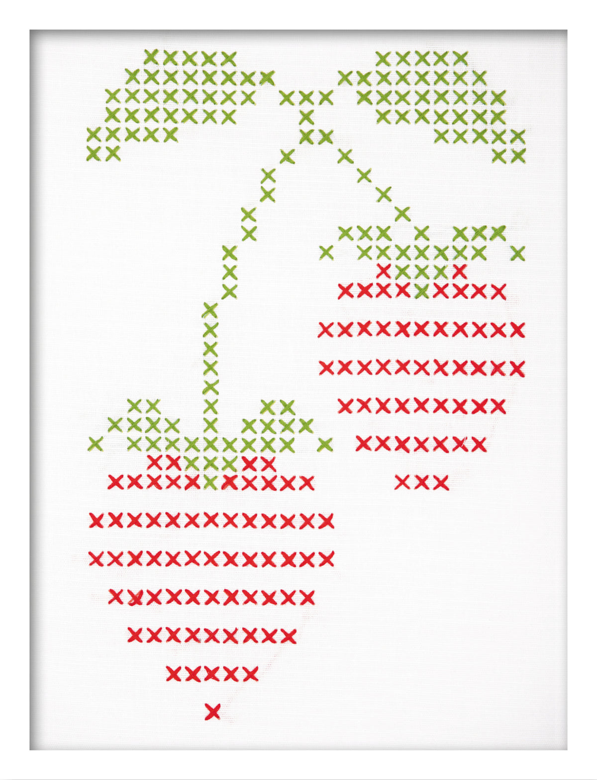 Embroidered strawberry design on white fabric