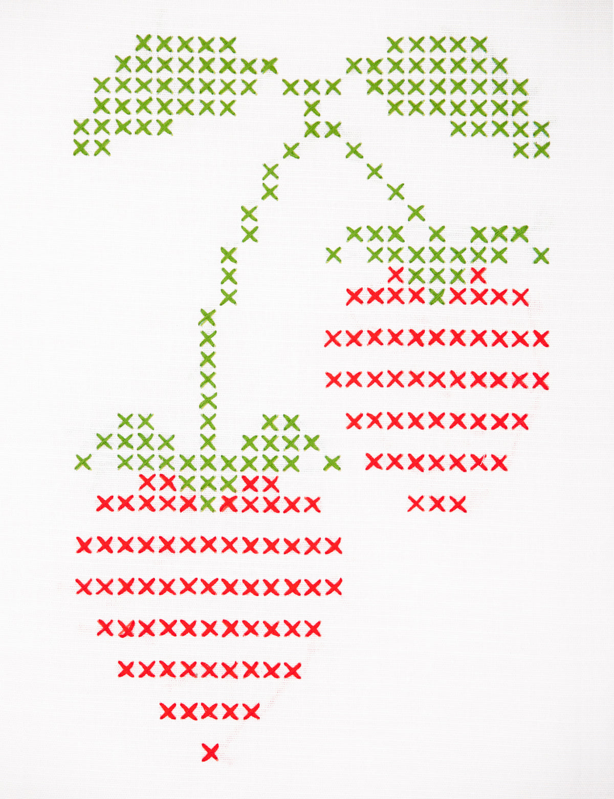 Embroidered strawberry design on white fabric
