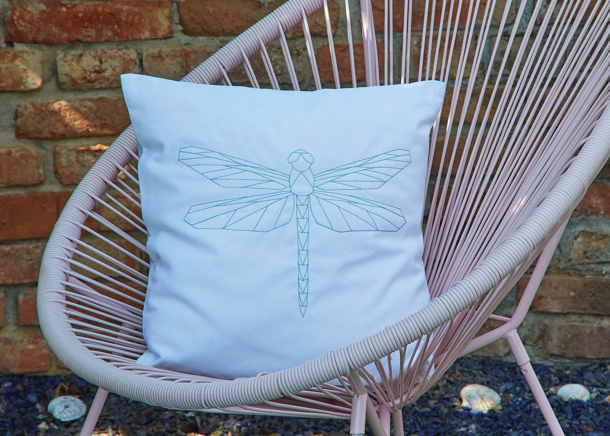 Cushion with a metallic geometric dragonfly design