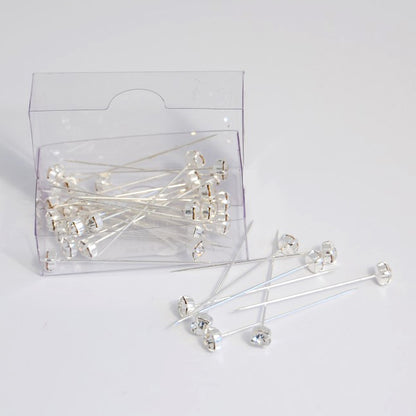 Silver corsage pins with diamante heads