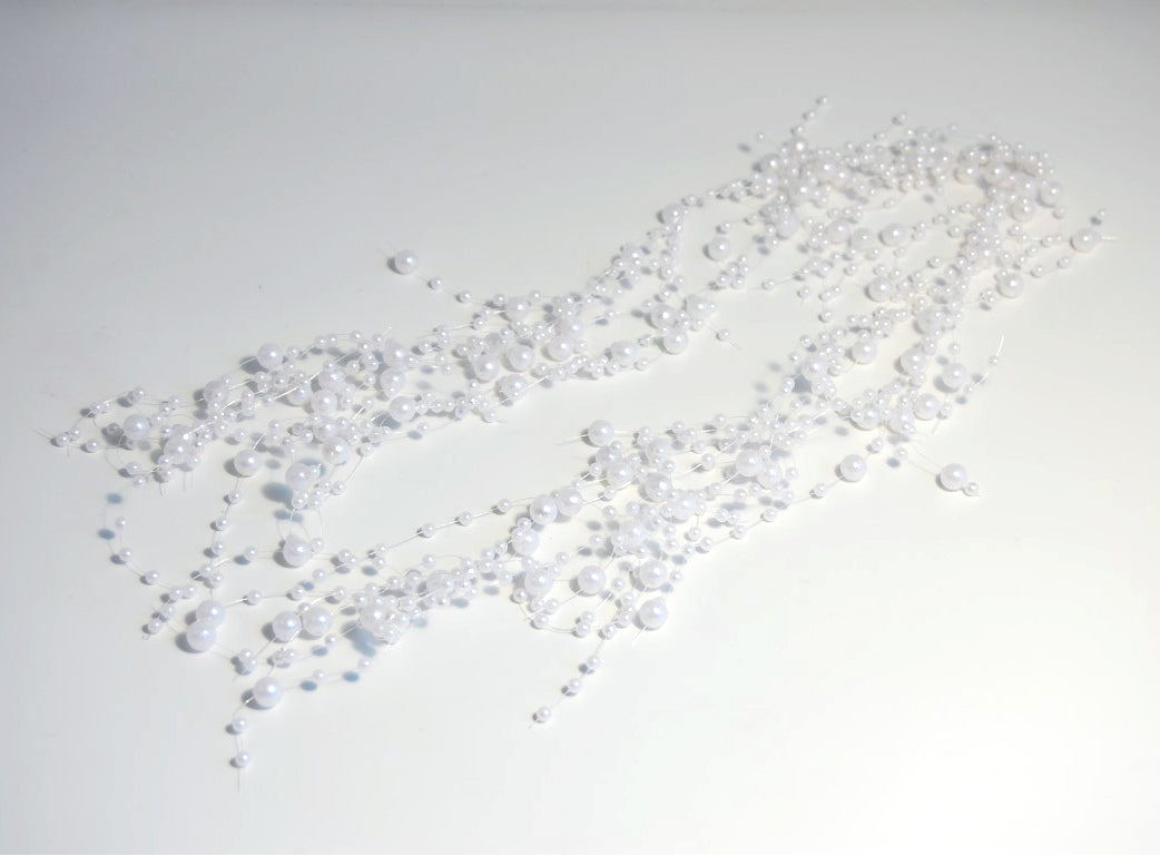 Strand of white mixed bead garland