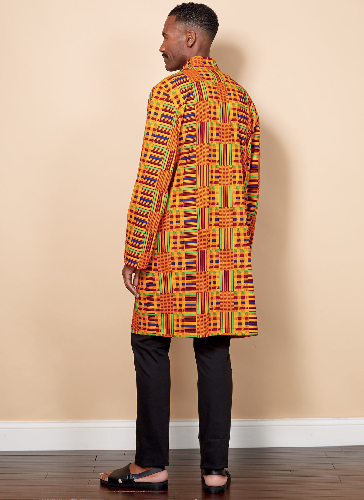 Butterick B6534 sewing pattern envelope showing unisex coat designs