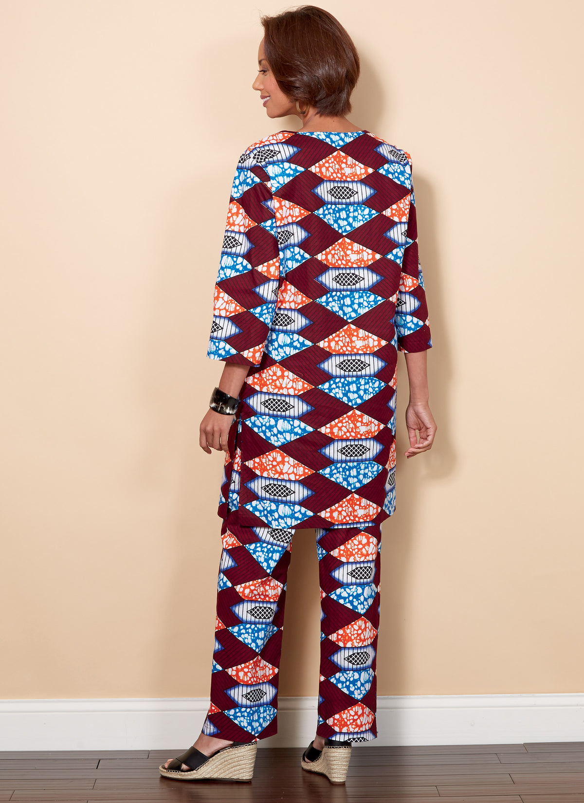 Butterick B6534 sewing pattern envelope showing unisex coat designs