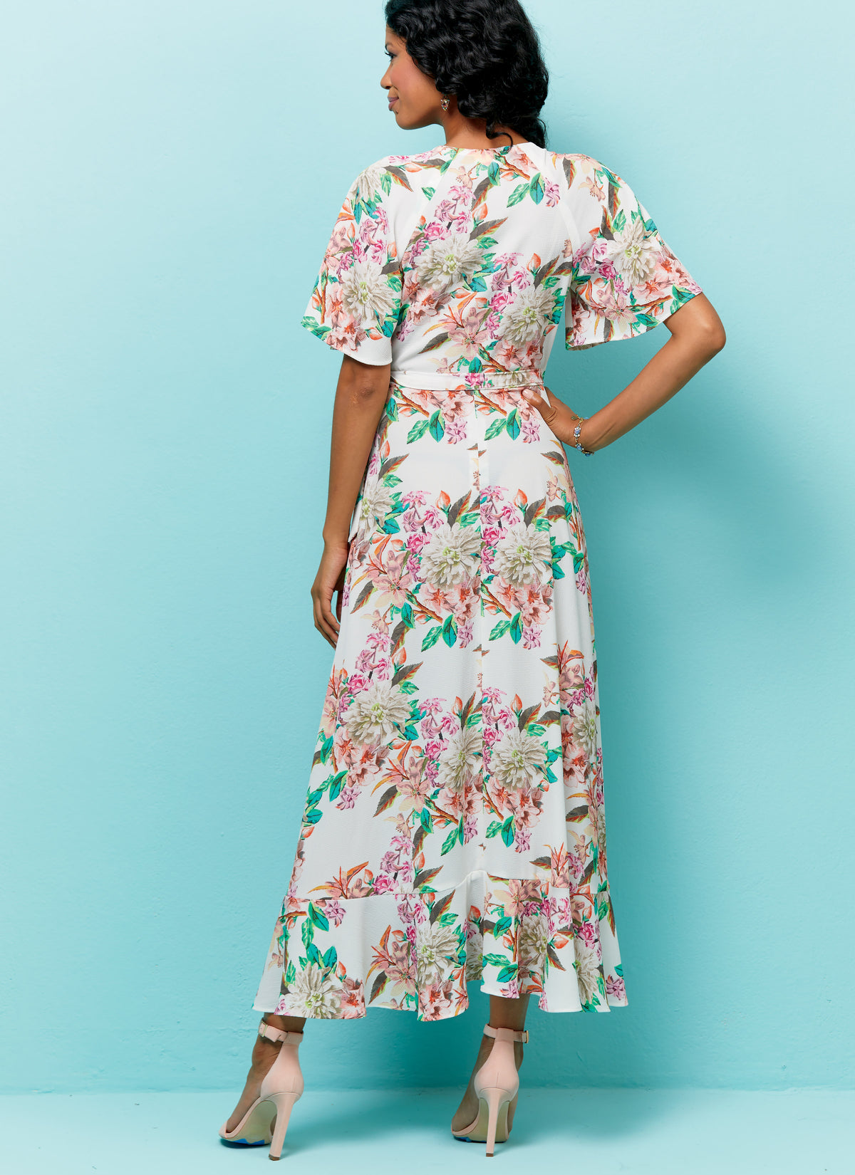 Butterick B6554 sewing pattern envelope showing misses wrap dress designs