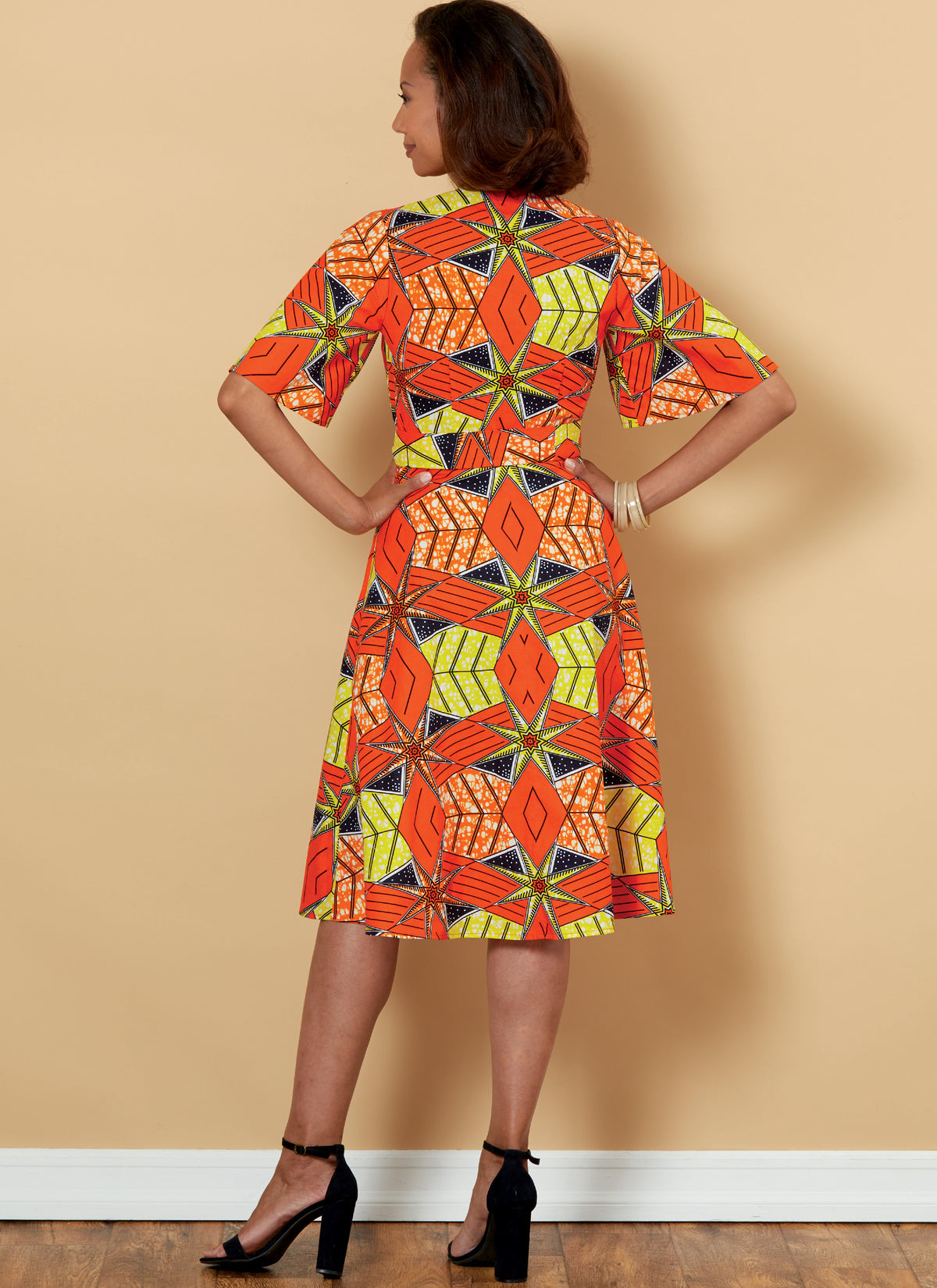 Butterick B6654 sewing pattern envelope showing misses wrap dress designs