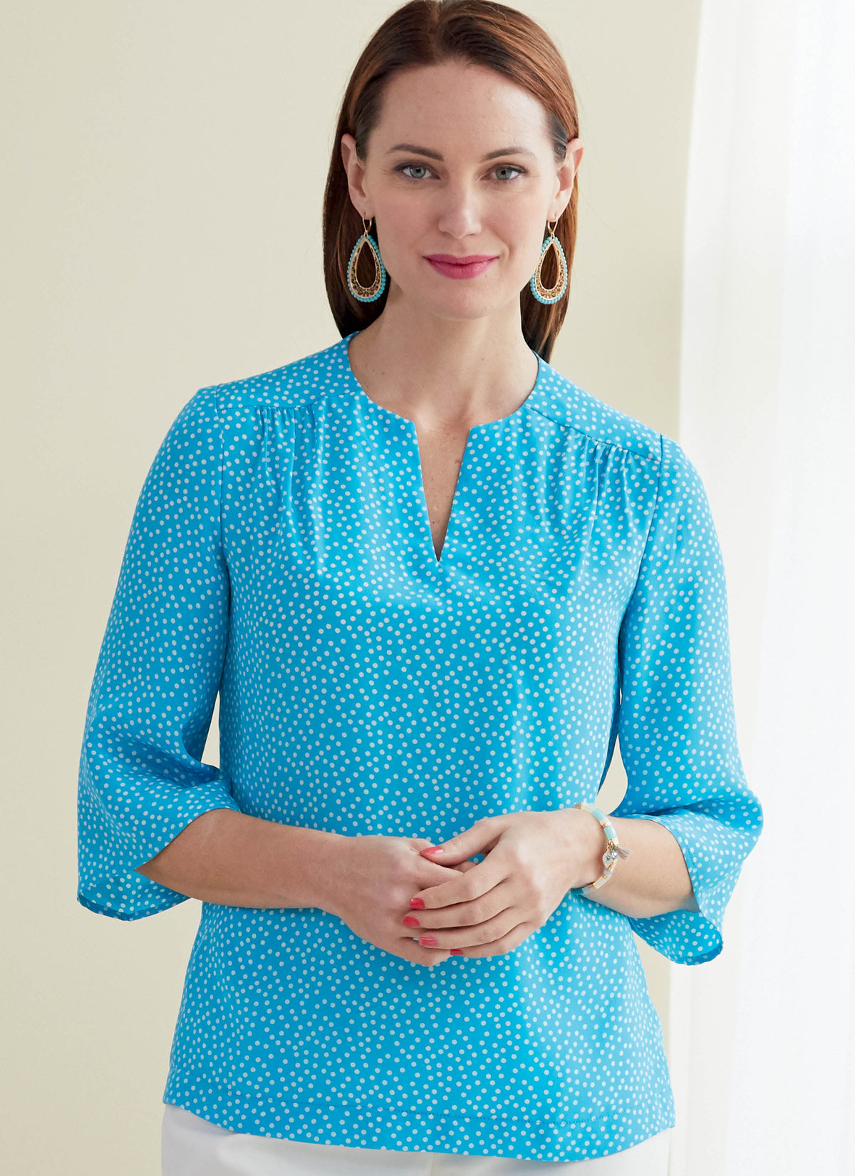 Butterick B6688 sewing pattern envelope showing a semi-fitted top with a self-faced yoke