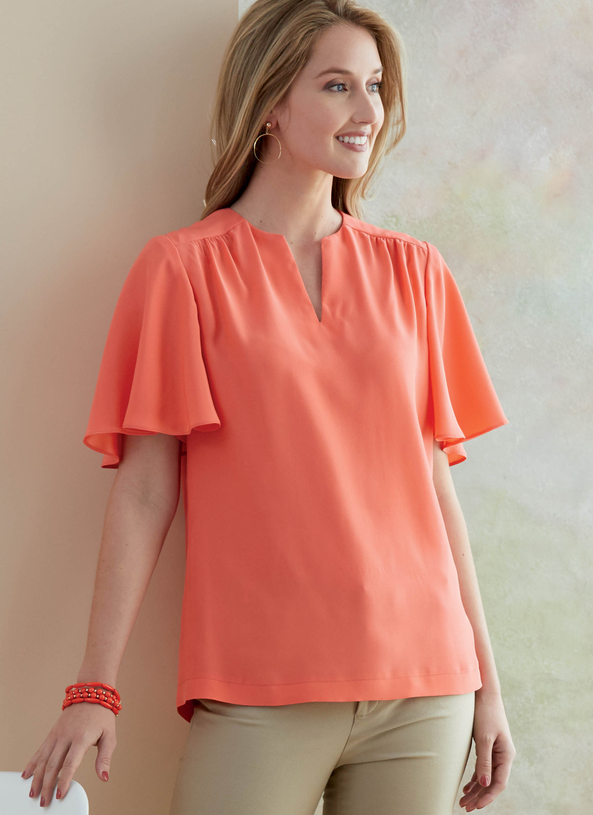 Butterick B6688 sewing pattern envelope showing a semi-fitted top with a self-faced yoke