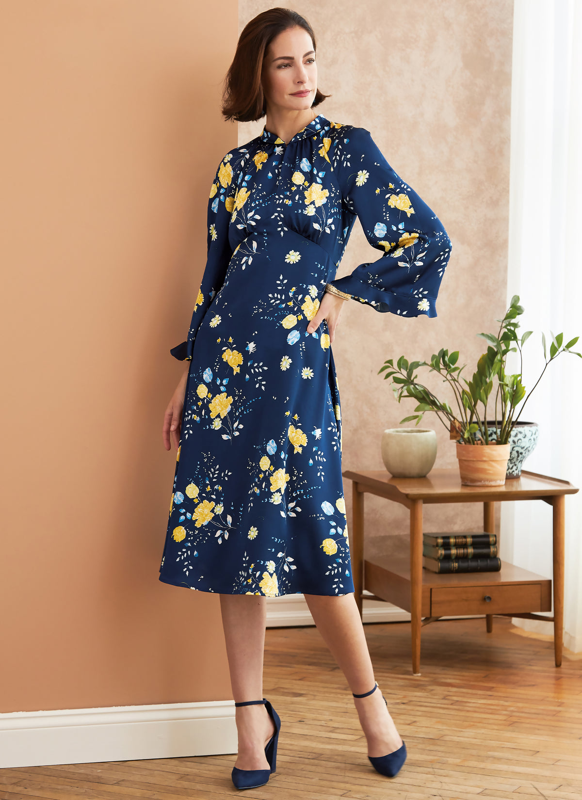 Butterick B6705 sewing pattern envelope showing a close-fitting dress in two lengths