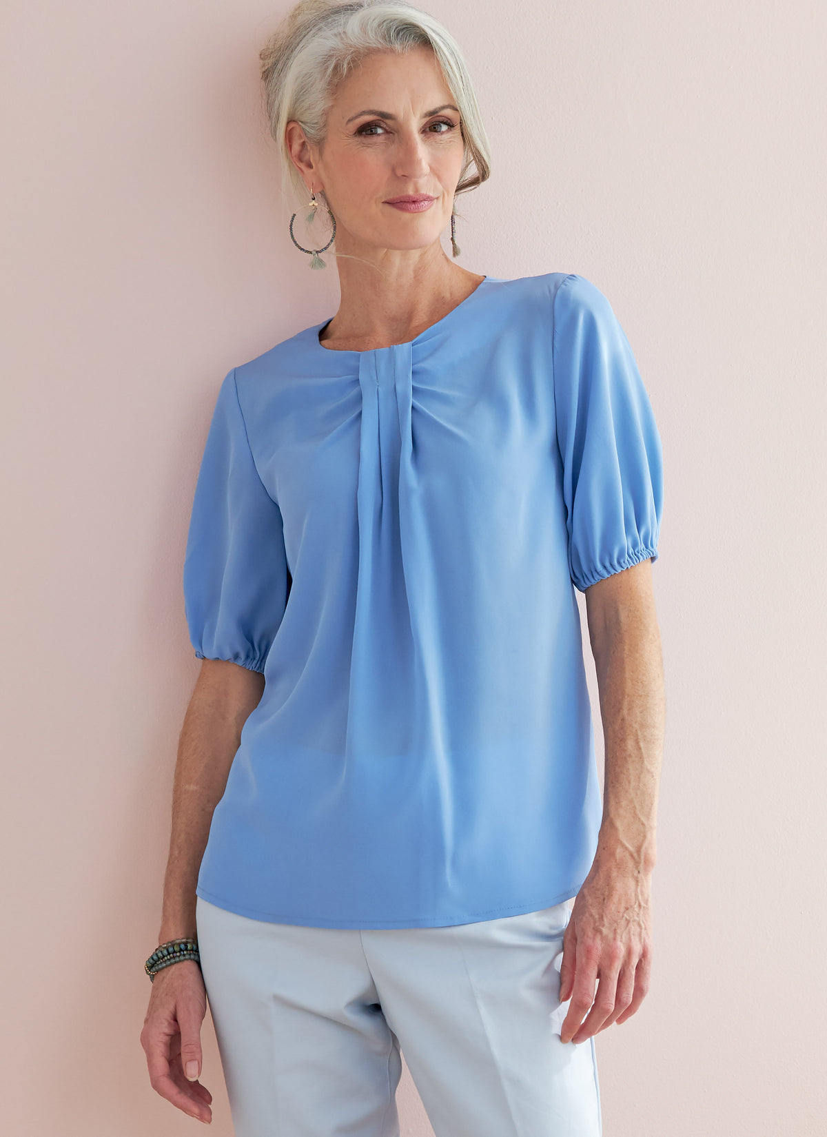 Butterick B6730 sewing pattern envelope showing tops with front neckline tucks