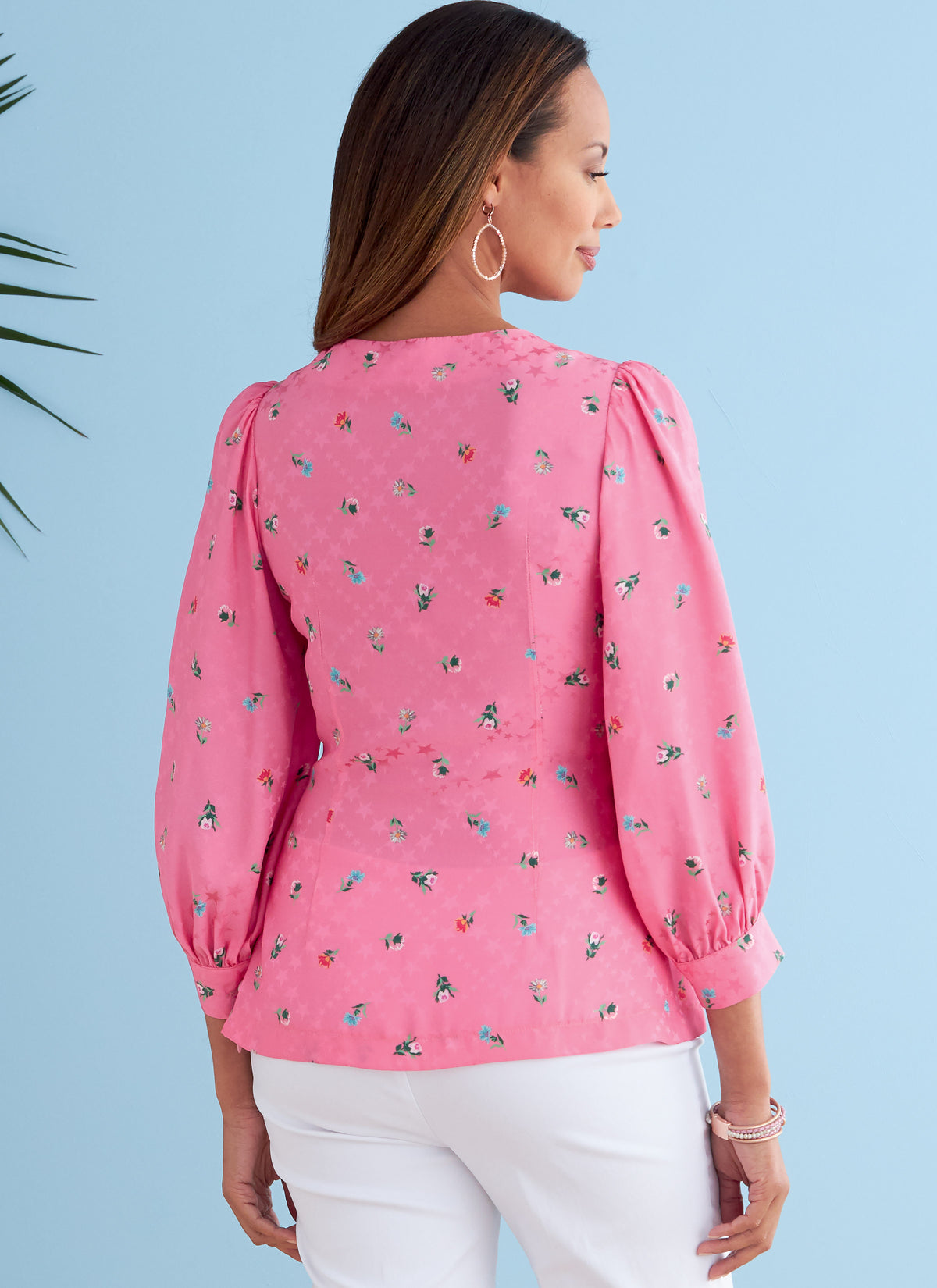 Butterick B6731 sewing pattern envelope showing V-neck tops with front ties
