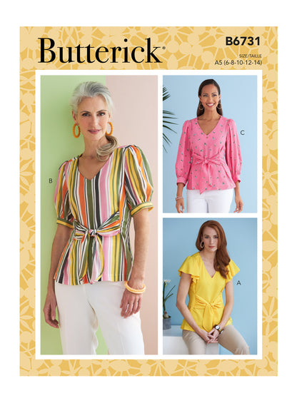 Butterick B6731 sewing pattern envelope showing V-neck tops with front ties