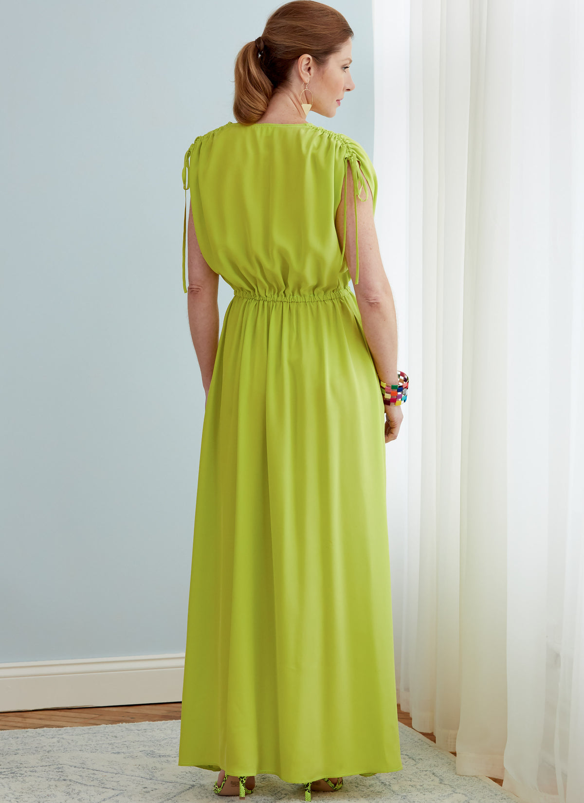 Butterick B6756 sewing pattern envelope showing misses' faux-wrap dress and jumpsuit designs