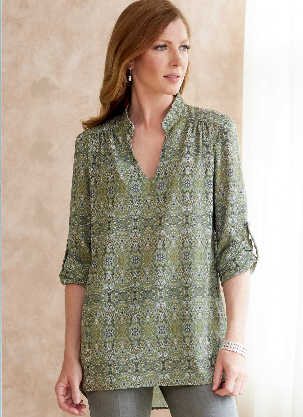 Butterick B6801 sewing pattern envelope showing women's loose pullover top designs
