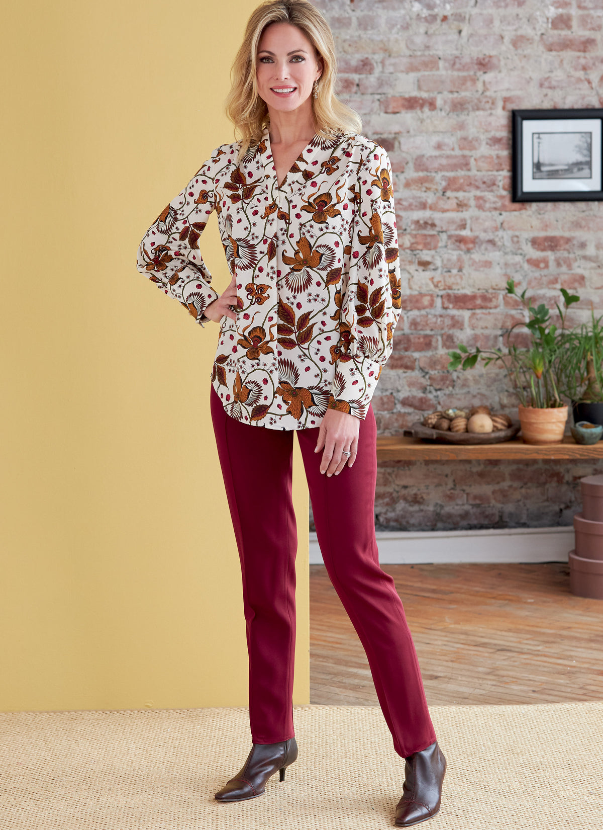 Butterick B6855 sewing pattern envelope showing women's v-neck top designs