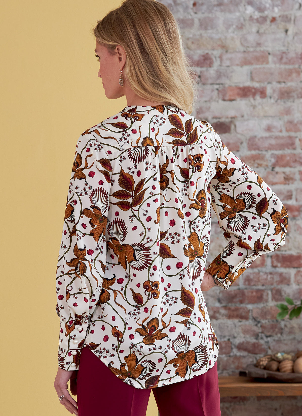 Butterick B6855 sewing pattern envelope showing women's v-neck top designs