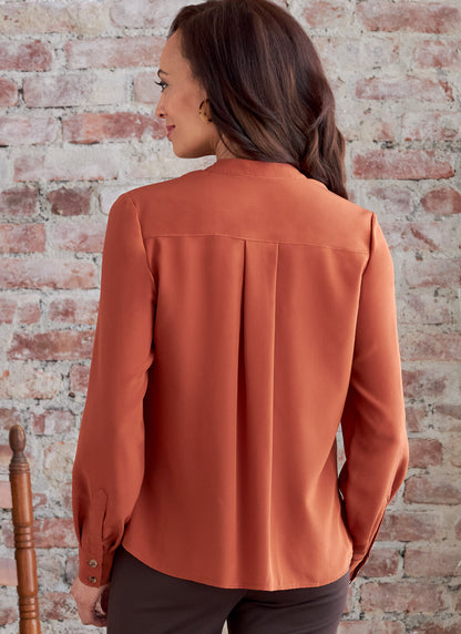 Butterick B6856 sewing pattern envelope showing women's button front top with pockets designs