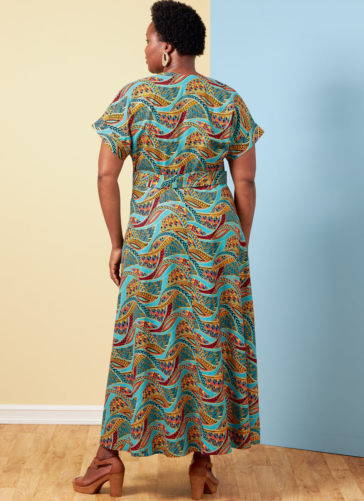 Butterick B6873 sewing pattern envelope showing women's wrap dress designs