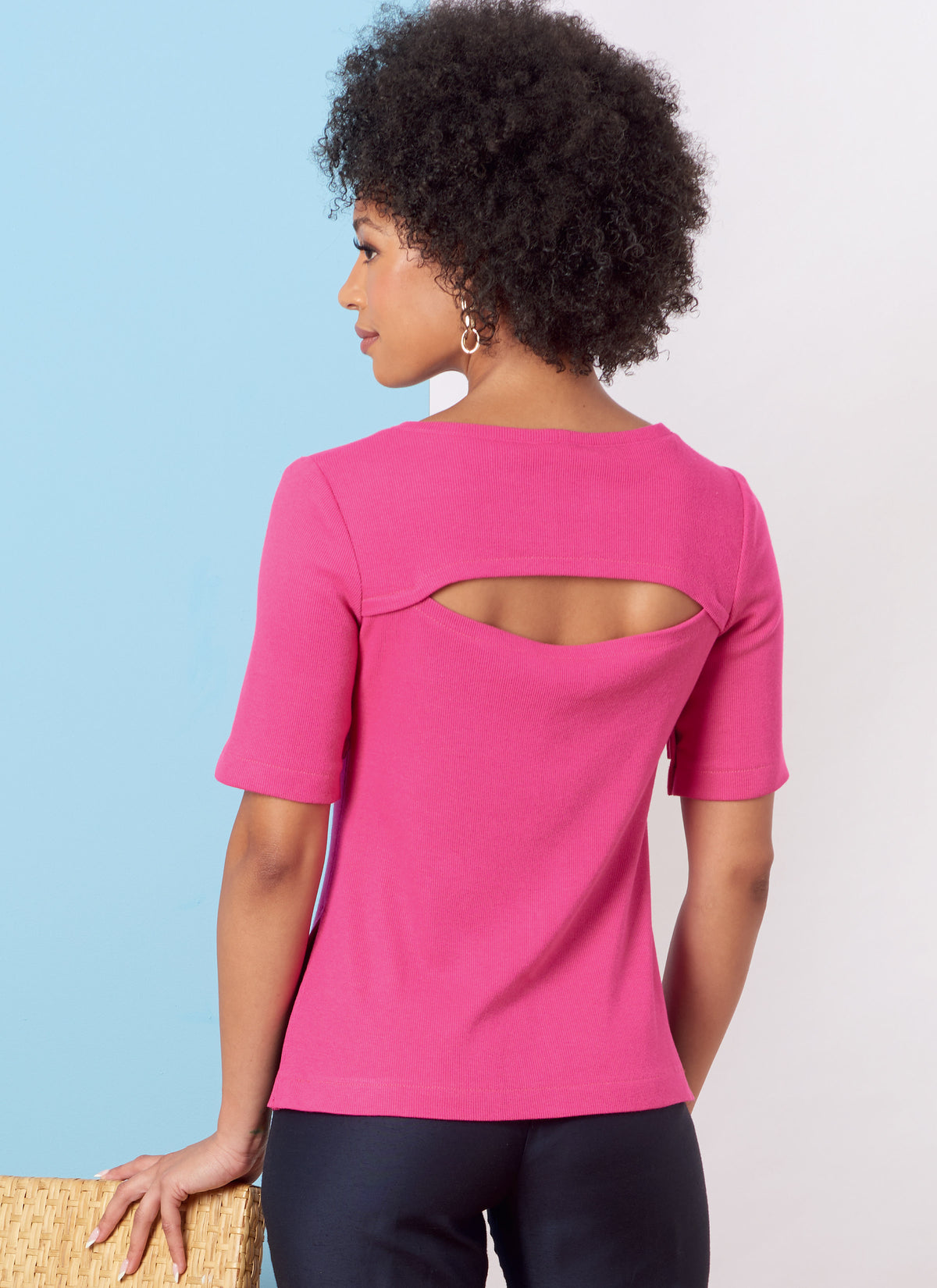 Butterick B6875 sewing pattern envelope showing misses' draped neck dolman top designs