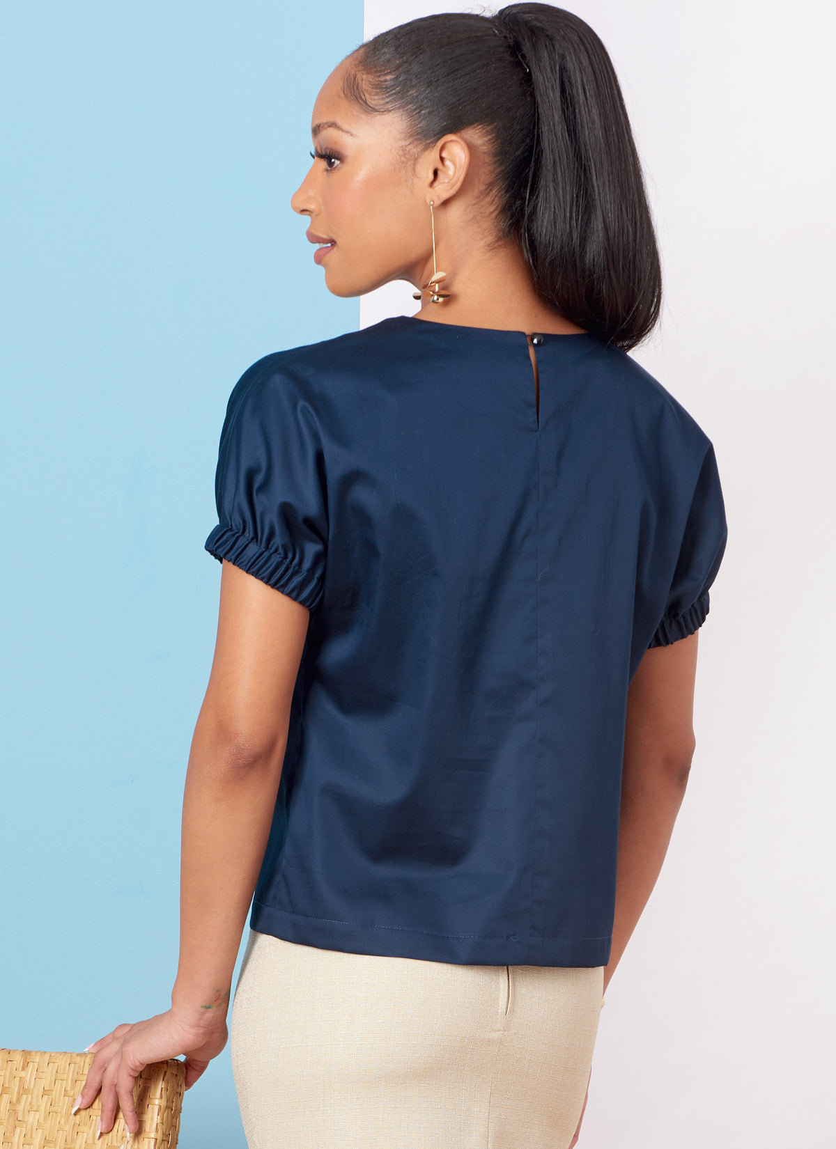 Butterick B6875 sewing pattern envelope showing misses' draped neck dolman top designs