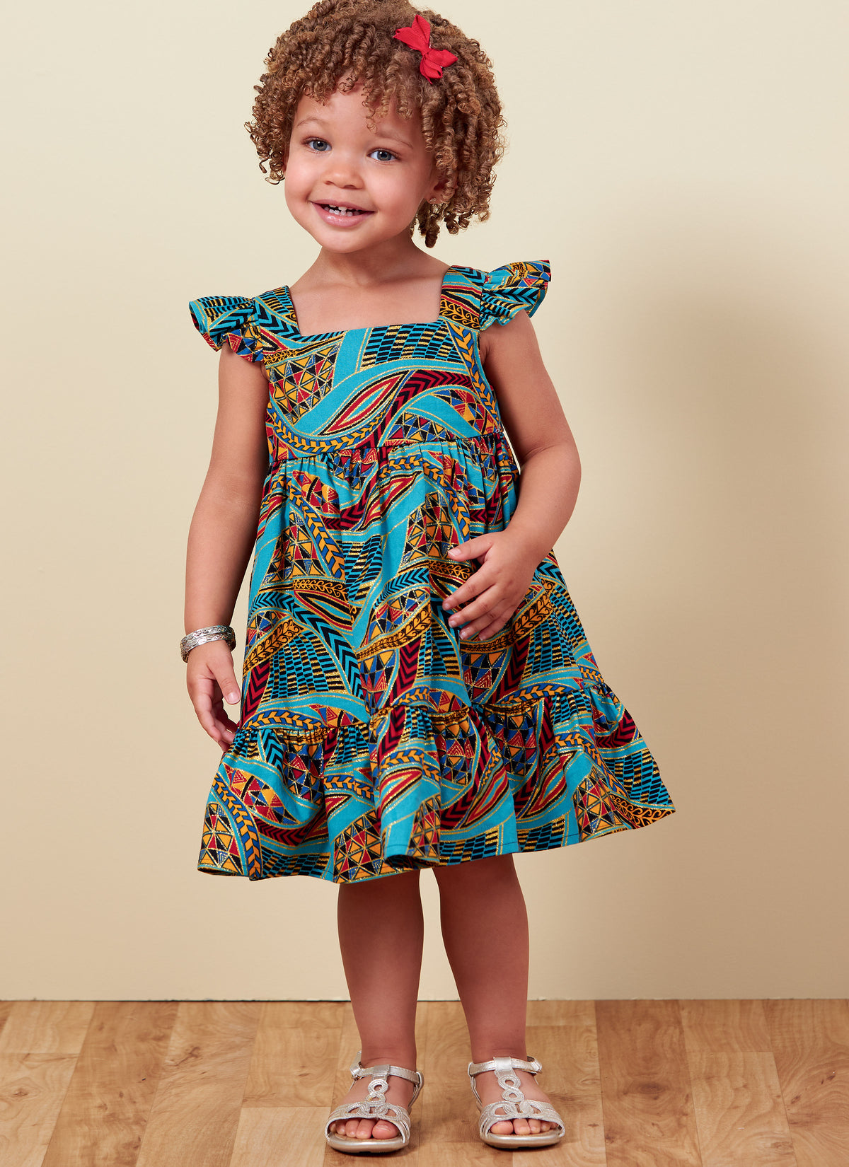 Butterick B6885 sewing pattern envelope showing toddler high waist dress designs