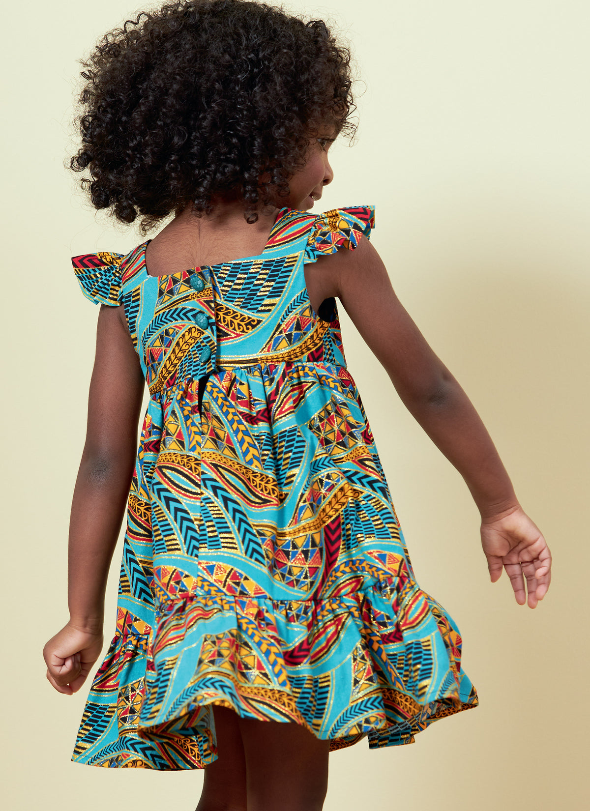 Butterick B6885 sewing pattern envelope showing toddler high waist dress designs