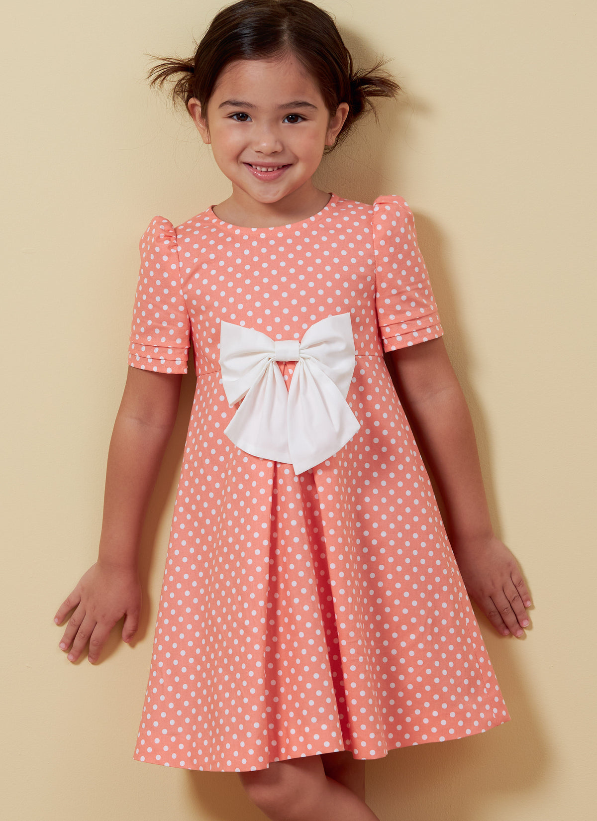 Butterick B6886 sewing pattern envelope showing children's a-line dress designs