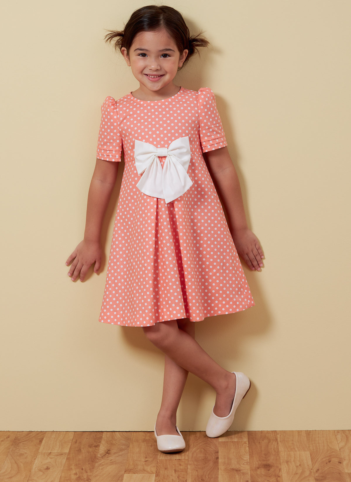 Butterick B6886 sewing pattern envelope showing children's a-line dress designs