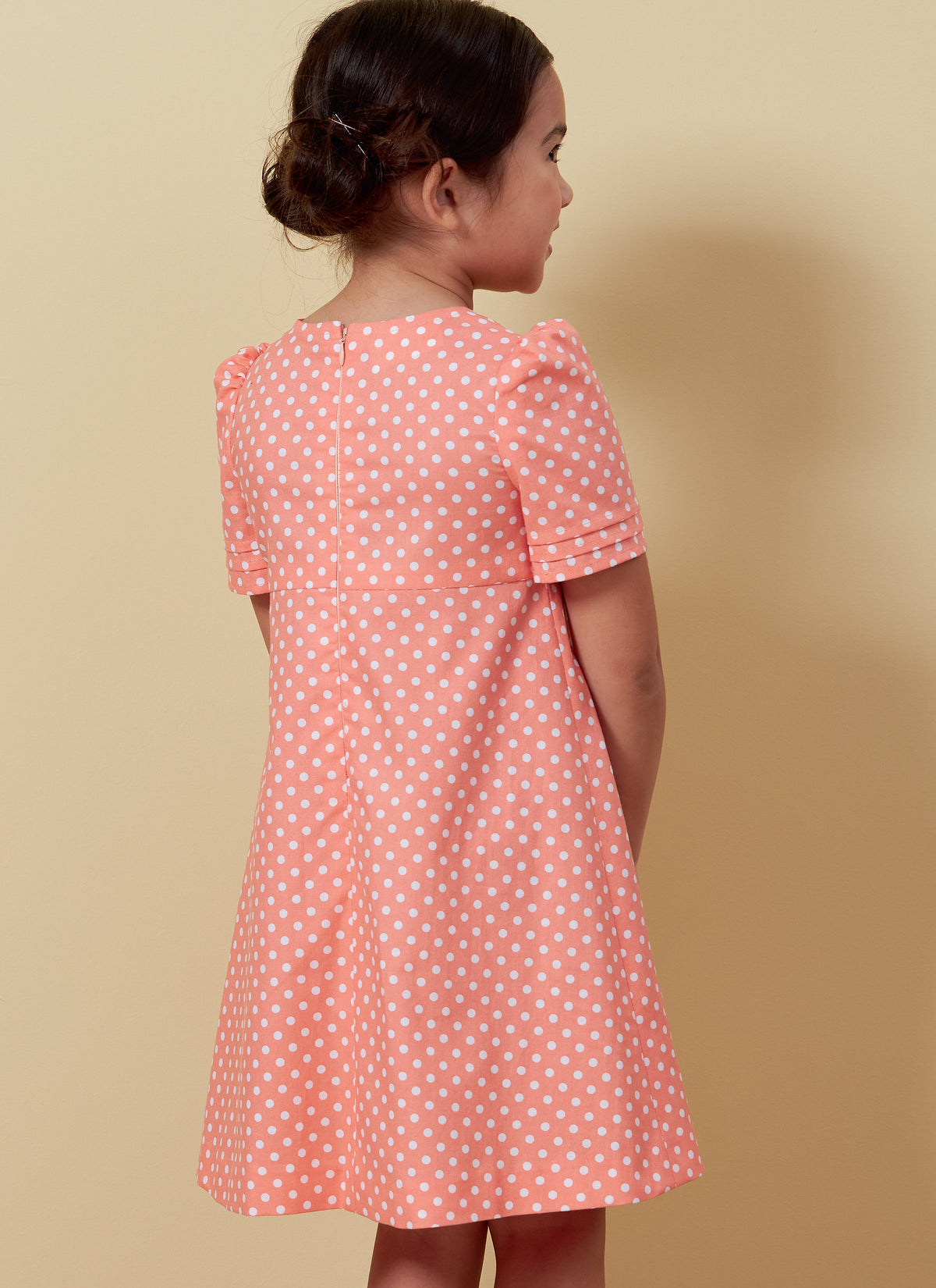 Butterick B6886 sewing pattern envelope showing children's a-line dress designs