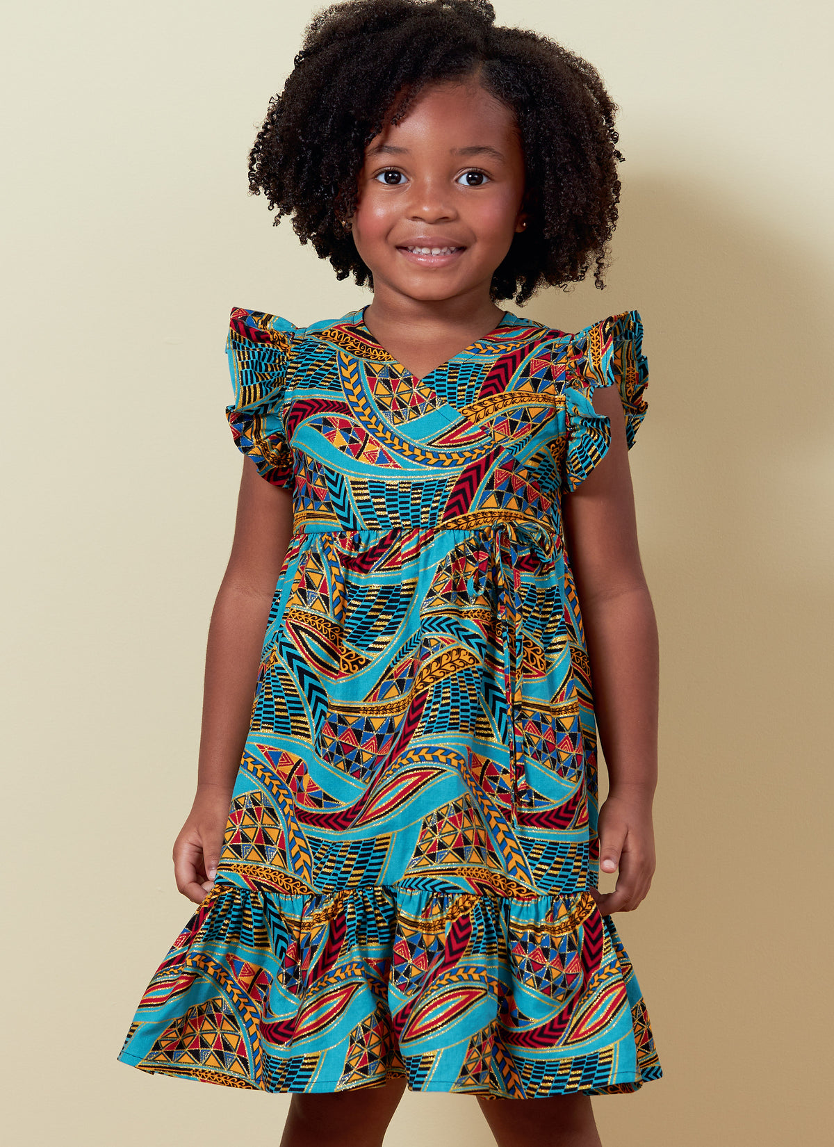 Butterick B6887 sewing pattern envelope showing children's faux wrap dress designs