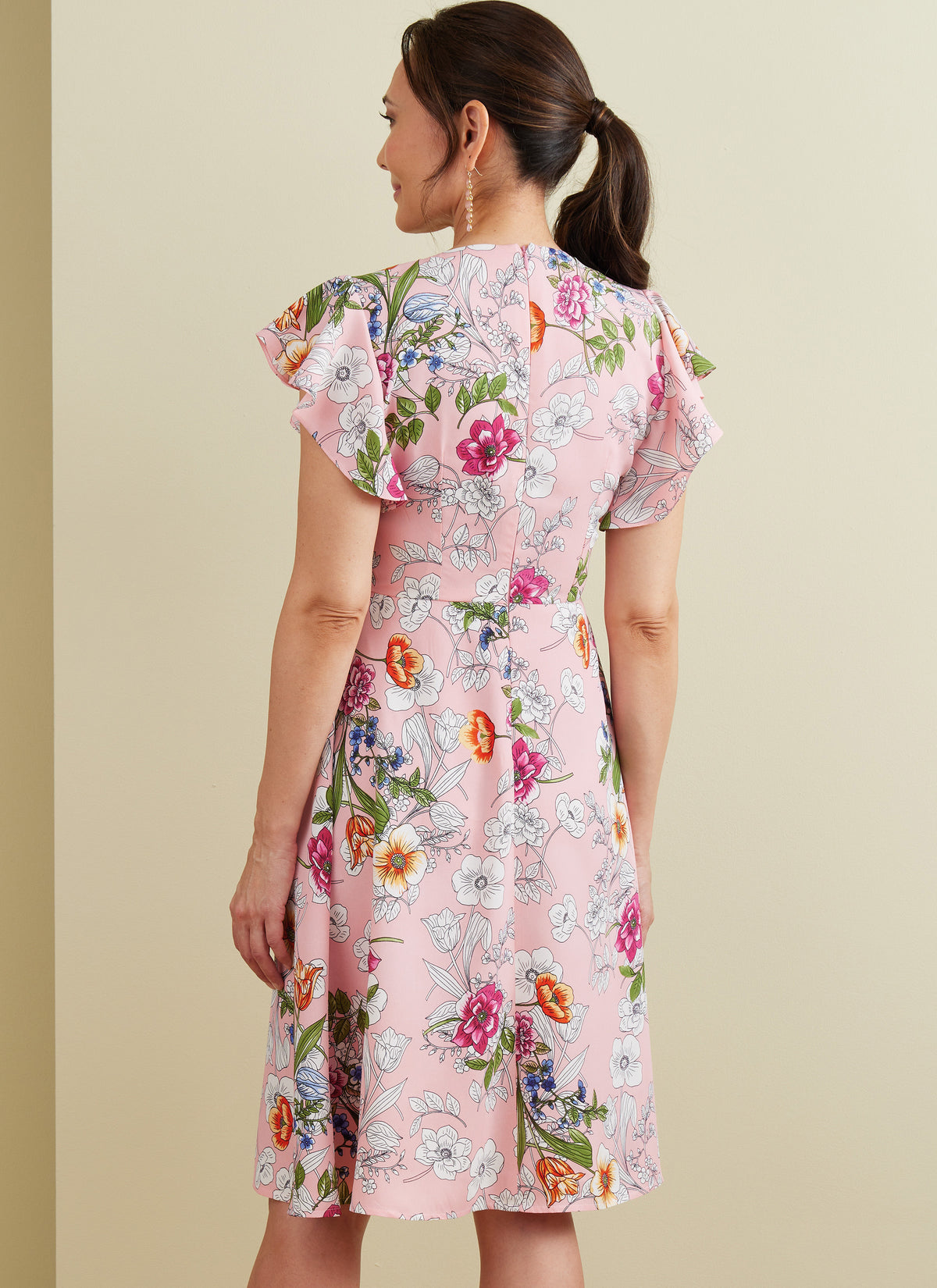 Butterick B6893 sewing pattern envelope showing misses' v-neck dress and jumpsuit designs
