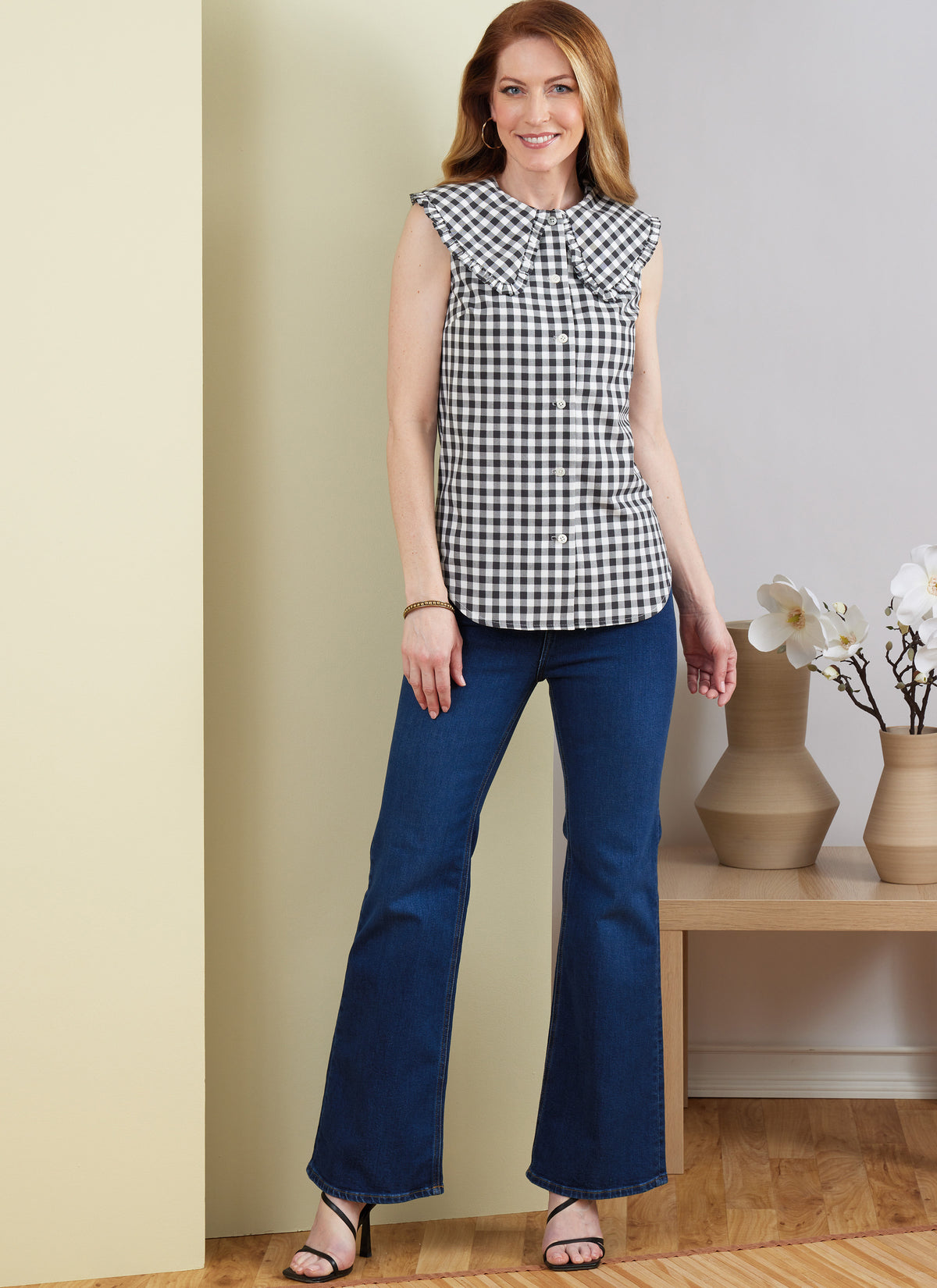 Butterick B6895 sewing pattern envelope showing misses' button front top designs