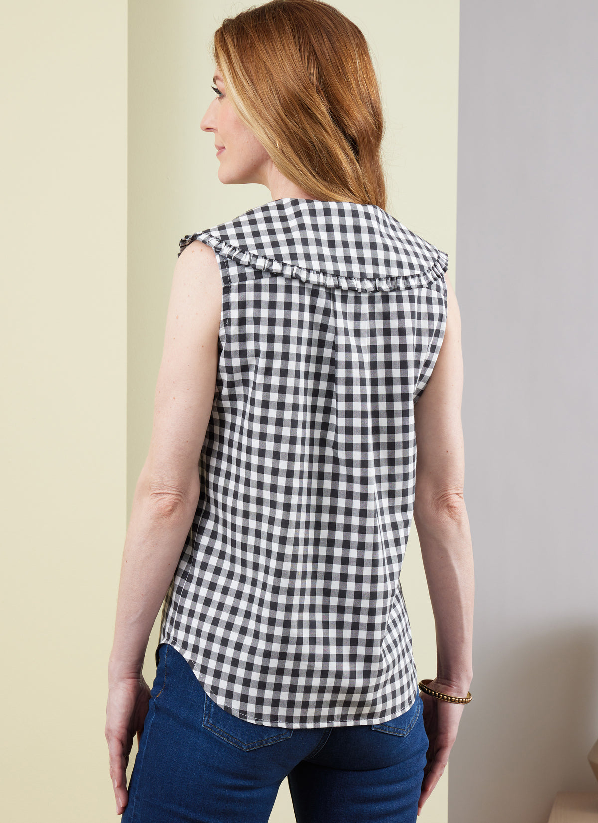 Butterick B6895 sewing pattern envelope showing misses' button front top designs