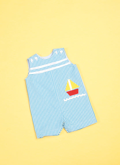 Butterick B6905 sewing pattern envelope showing the baby overalls, dress and knickers designs