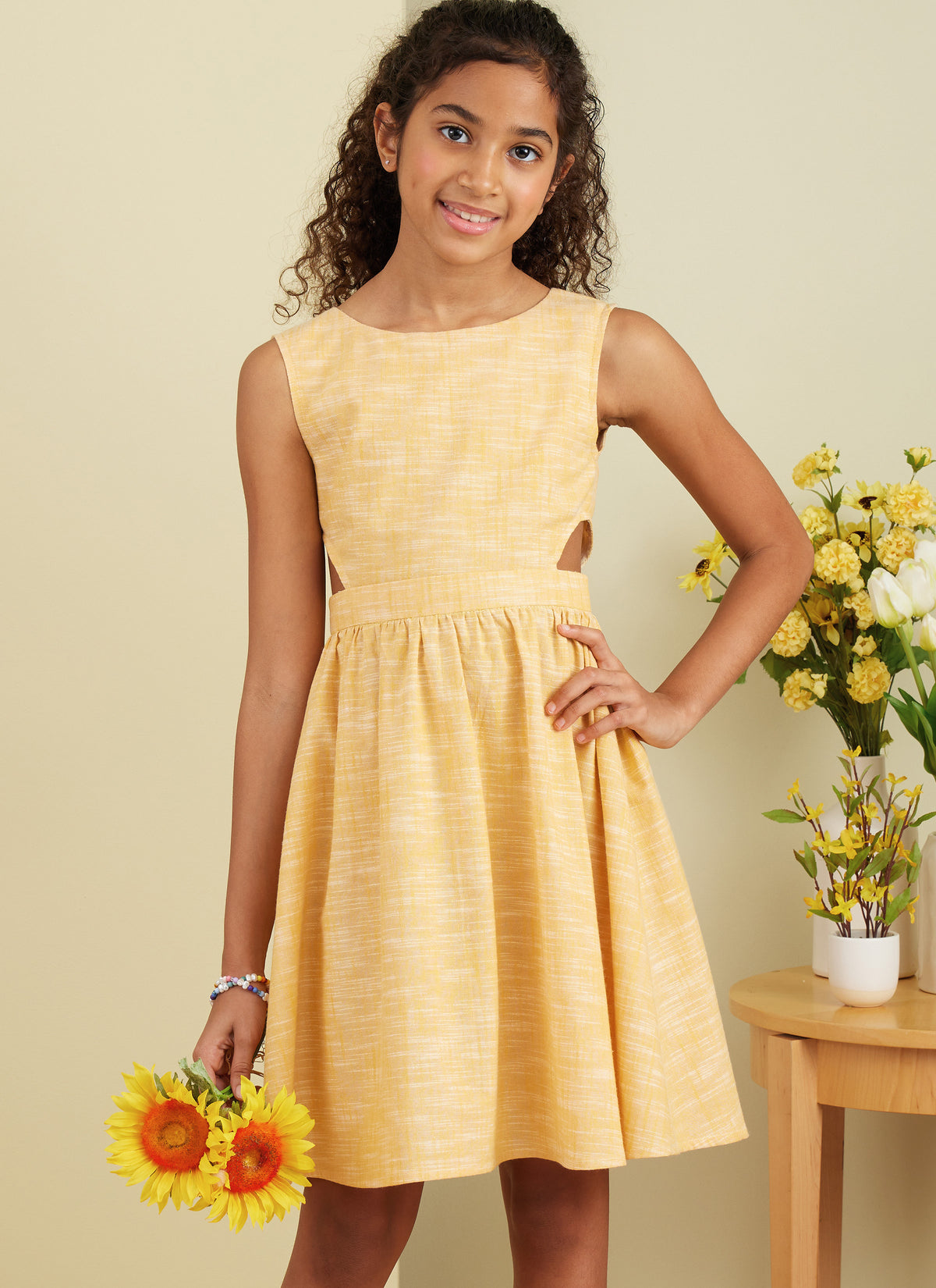 Butterick B6908 sewing pattern envelope showing the girls' full skirt dress designs