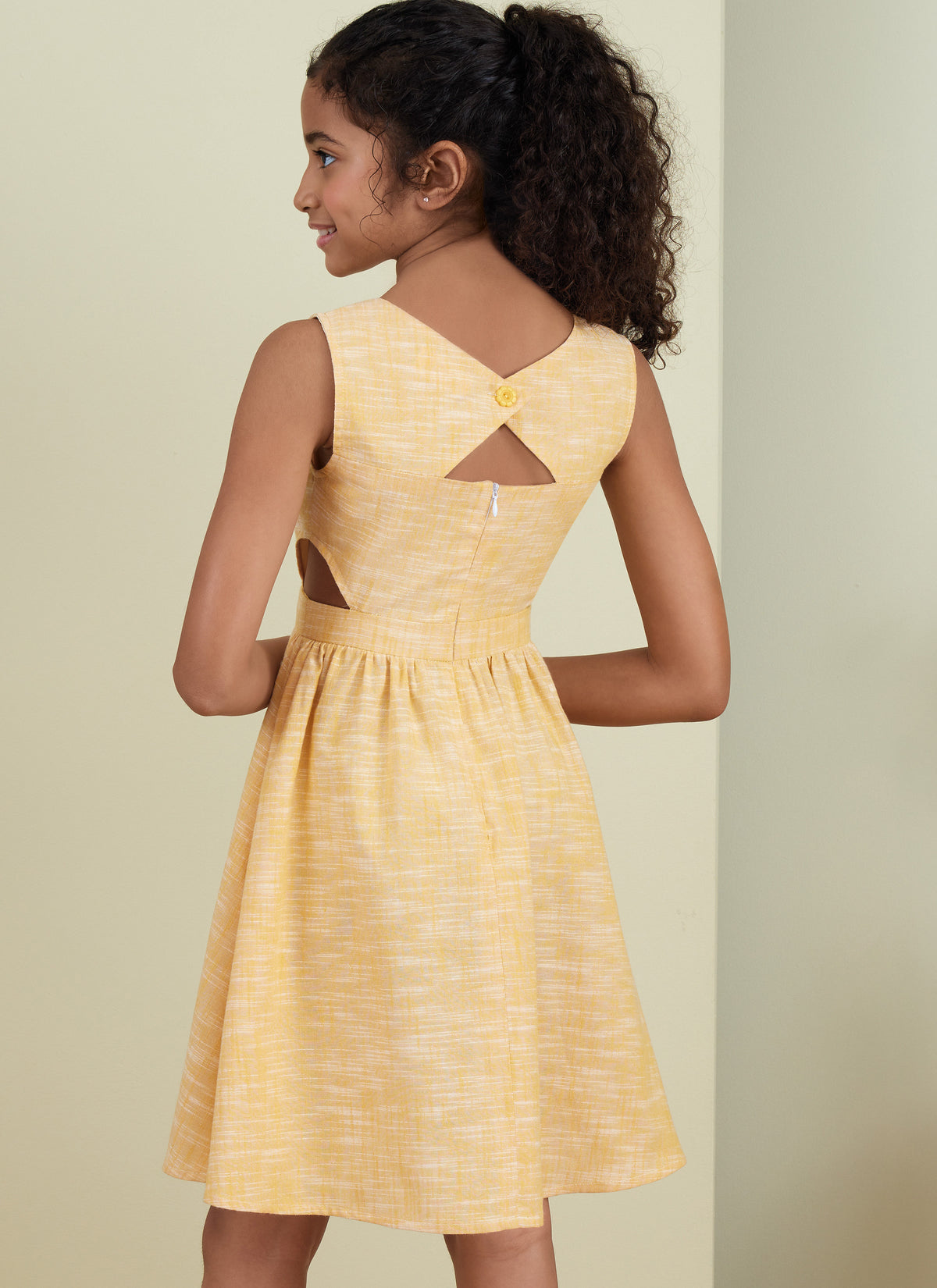 Butterick B6908 sewing pattern envelope showing the girls' full skirt dress designs